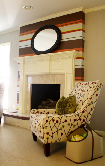 Traditional fireplace painted with modern horizontal stripes in varying widths and earth tone colors, from Kristen F. Davis Designs