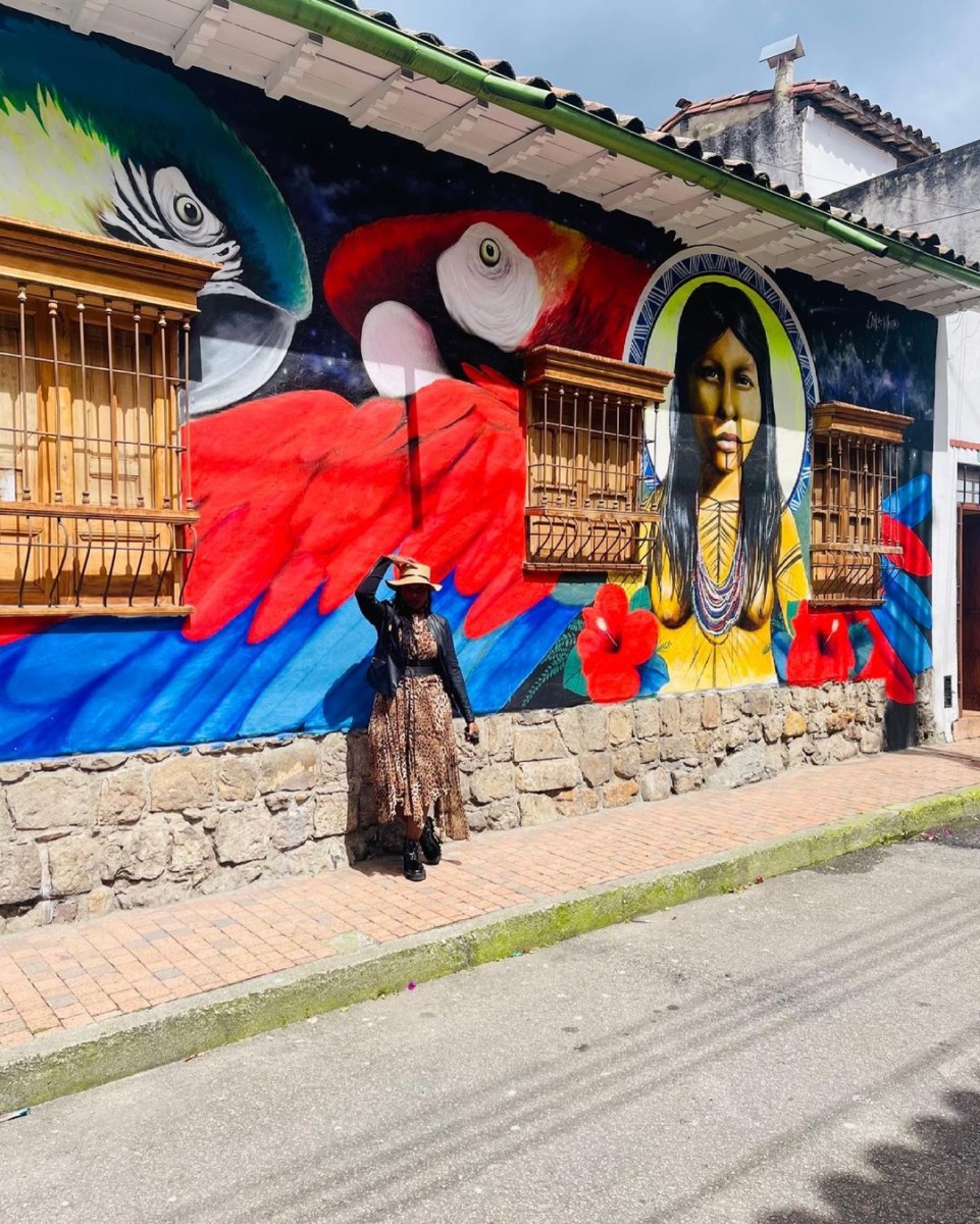 Maureen Waititu taking a picture at Bolivar Square (Plaza de Bolívar de Bogotá).