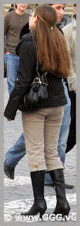 Red-head girl in high heels on the street