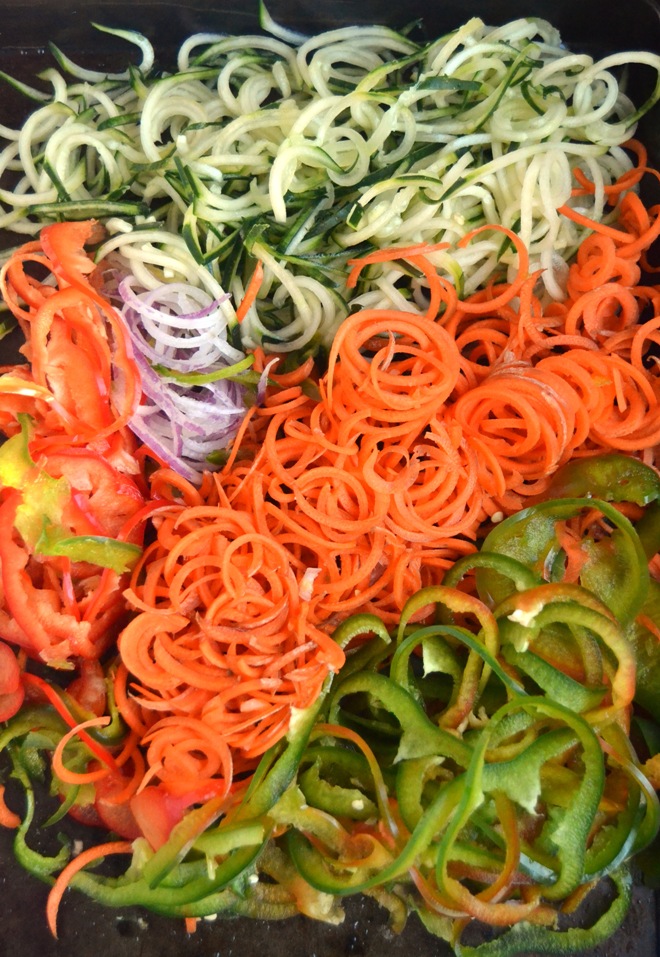 Spiralized Antipasto Salad takes a fun and unique spin on traditional antipasto salad with spiralized vegetables including peppers, onions, carrots and cucumbers, pepperoni, cheese, tomatoes, and a homemade Italian dressing! www.nutritionistreviews.com
