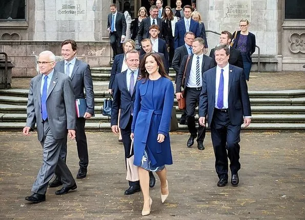 Crown Princess Mary wore Prada nude pointed toe pump, carried Prada Saffiano Cuir Double Bag, By Malene Birger blue belted wool-blend coat and print dress