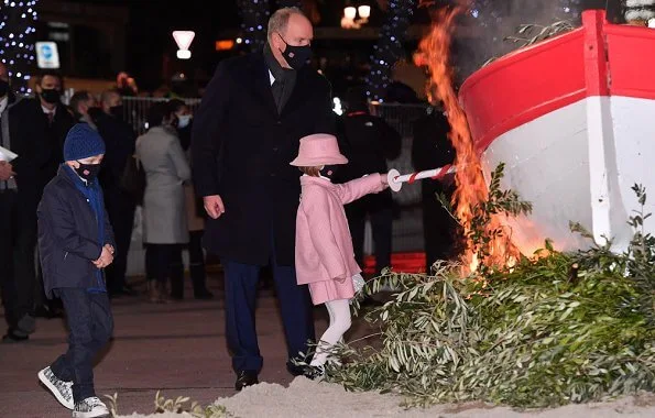 Princess Charlene wore a new leather-trimmed wool-blend tweed coat from Akris. Princess Gabriella wore a tweed jacket and skirt from Jacadi, Dior