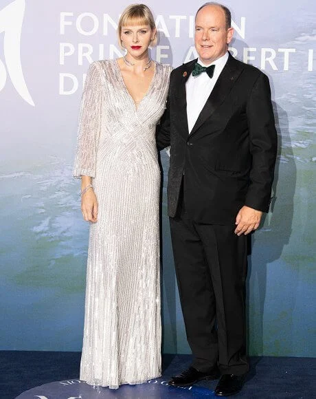 Princess Charlene wore a new v-neck sequin gown from Jenny Packham, and Brevis diamond necklace from Repossi. Pauline Ducruet red suit