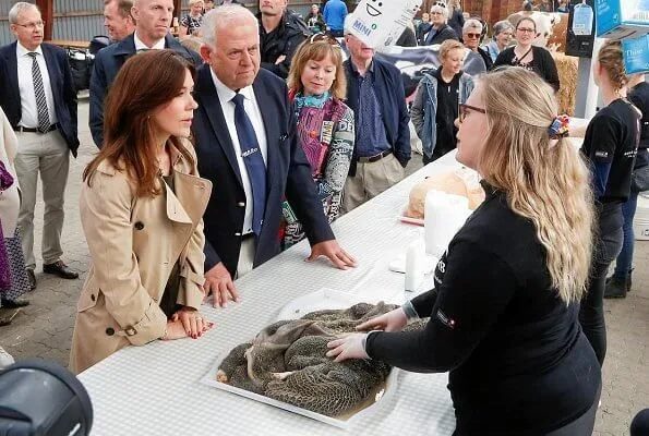 Crown Princess Mary wore a Ralph Lauren double breasted trench coat, a velvet trousers, and a sweater at agricultural and livestock fair