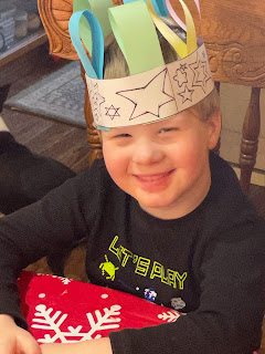 I heard something about cake and presents! Charlie wearing a paper crown, made in church last week