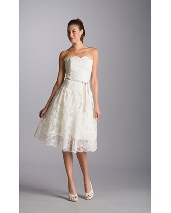 8th archetypal is Knee breadth strapless bells dress featuring a scalloped