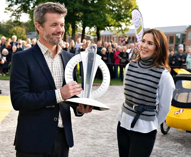 The Crown Prince Couple's Awards 2021. Crown Princess Mary wore a grey over shirt light military, and stripe knit sweater