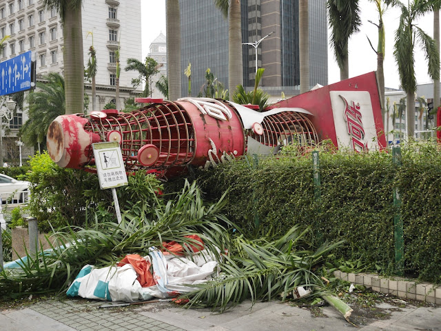 tipped over large Coca-Cola bottle