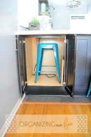 Hidden cabinet on peninsula to hold extra stool :: OrganizingMadeFun.com