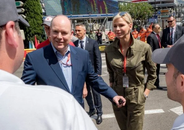 Princess Charlene wore Ralph Lauren Olive Cotton Twill Military Coverall. Prince Jacques and Princess Gabriella wore Ray-Ban sunglasses.