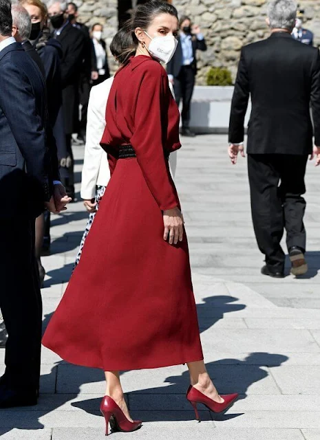 Queen Letizia wore a limited edition burgundy red open back dress from Massimo Dutti