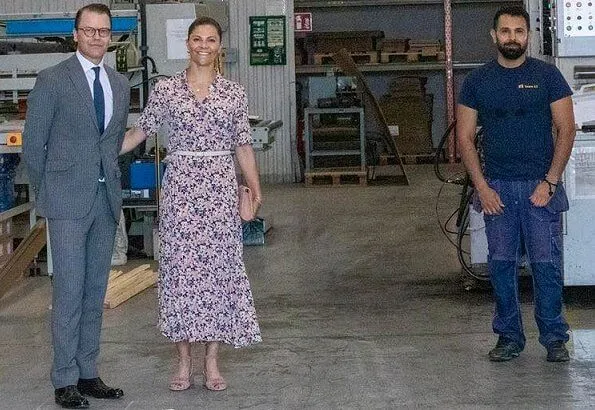 Crown Princess Victoria wore a floral crape dress by Arket, and white a lace dress from H&M Ltd collection. Rizzo sandals, gold earrings