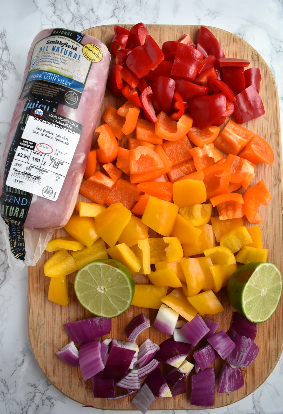 Pork Fajita Kebabs are ready in 30 minutes, are full of fajita flavors and are nutritious with marinated fajita lime pork, colorful bell peppers and onions! www.nutritionistreviews.com #grill #grilling #fajitas #mexican #mexicanfood #cincodemayo #pork #peppers Chopped peppers, red onions and pork