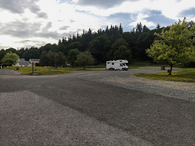 Photo of our motorhome, all alone in a huge car park.
