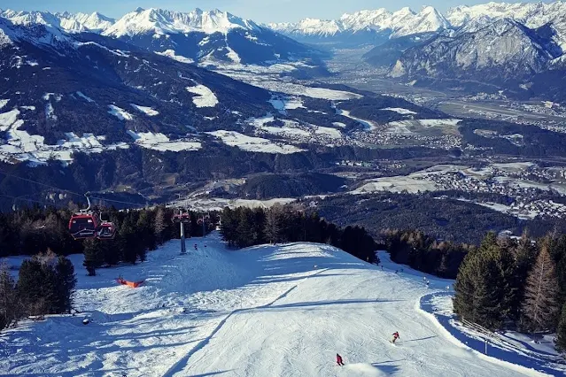 Things to do in Innsbruck in winter: Watch the skiers at Things to do in Innsbruck in winter: lunch at Schutzhaus on Patscherkofel