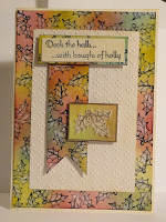 Christmas card with holly pattern border and banner