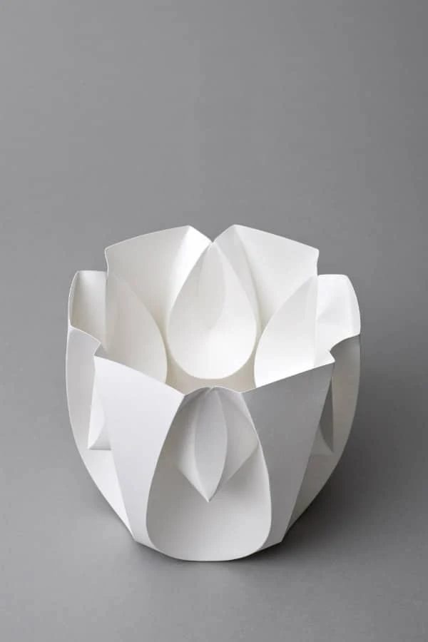 white folded and curved paper sculpture model