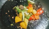 Sauteing exotic vegetables with garlic for White sauce vegetable pasta recipe