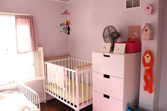 crib and bed in small room