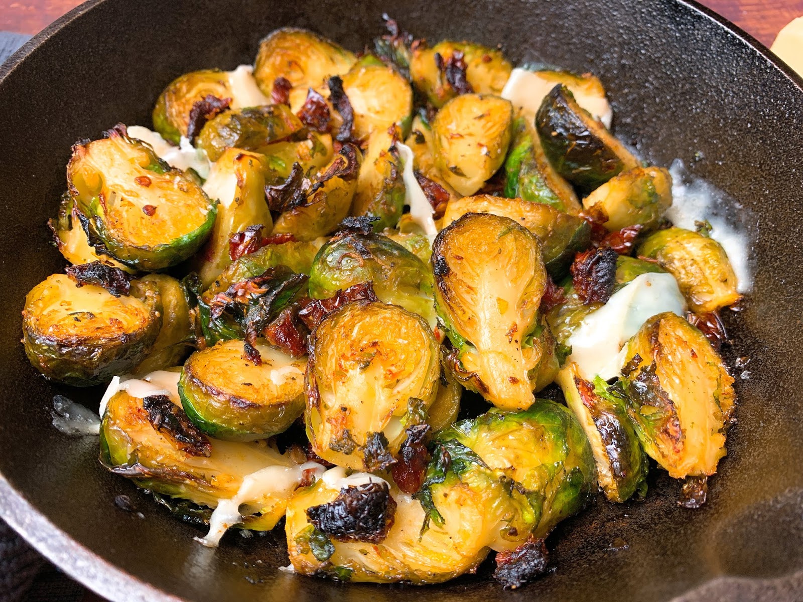 Roasted Brussels Sprouts with Sun Dried Tomatoes and Shaved Parmesan