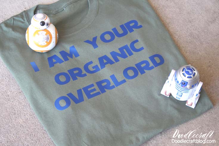 Sideways shot of the shirt with a BB8 and R2D2 toy decorating the shirt made using the Cricut Maker and EasyPress.