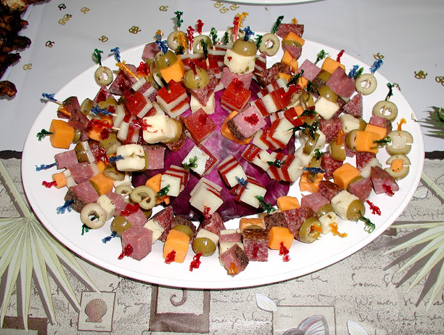 deli meats, cheese cubes, olives, quince paste,
