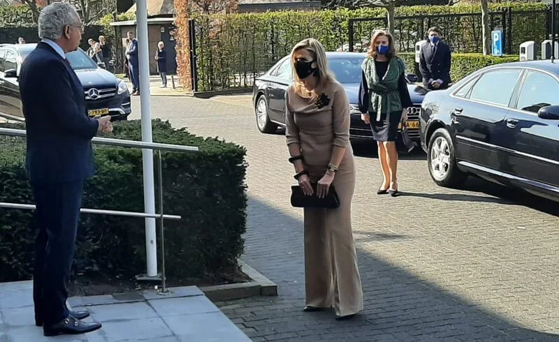 Queen Maxima wore beige top and beige trousers from Natan. Maison van Belle black earrings. Natan black brooch