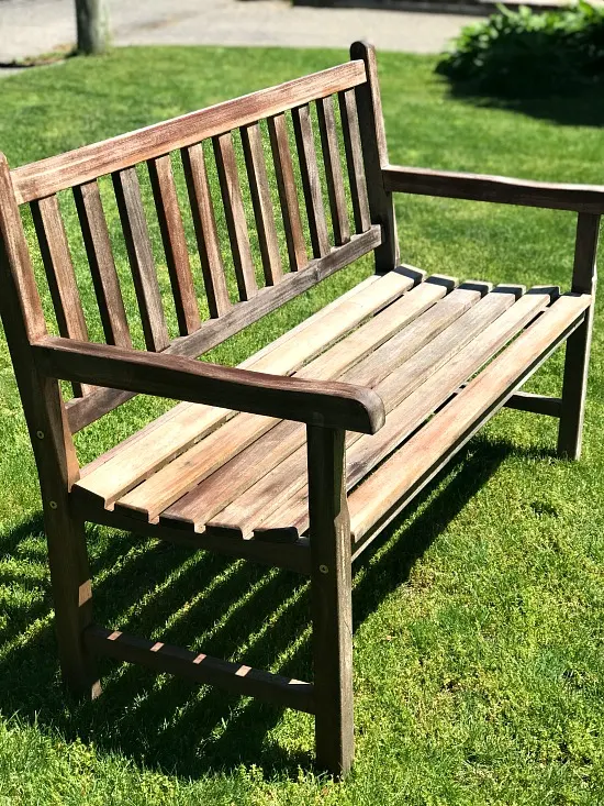 Teak bench drying on the lawn