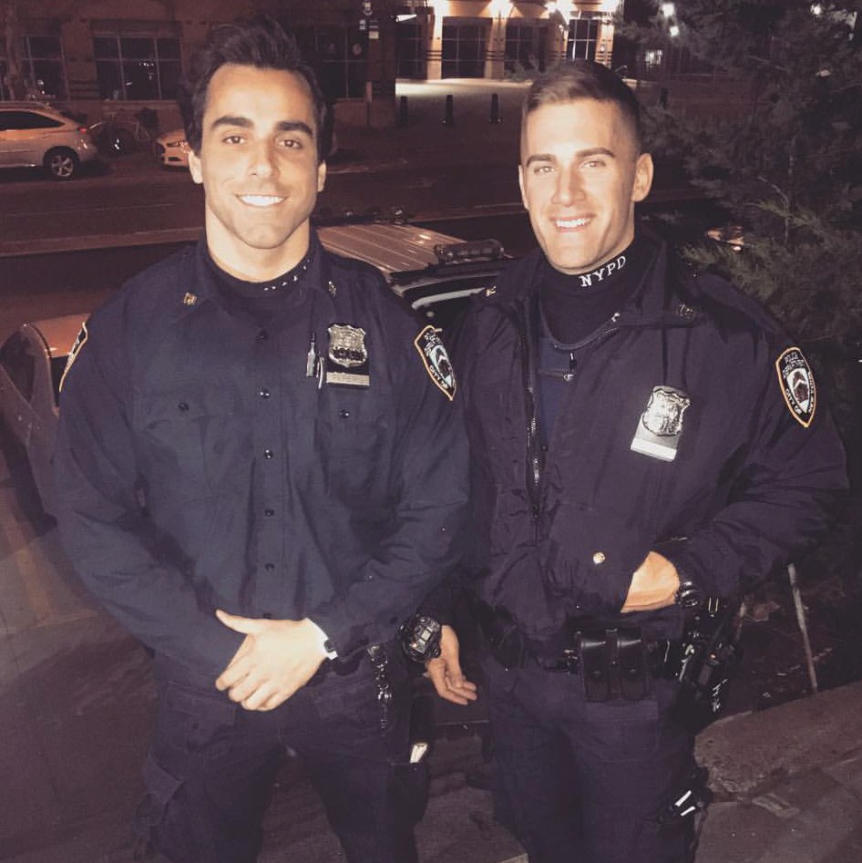 two-cute-young-handsome-uniformed-new-york-policemen-smiling