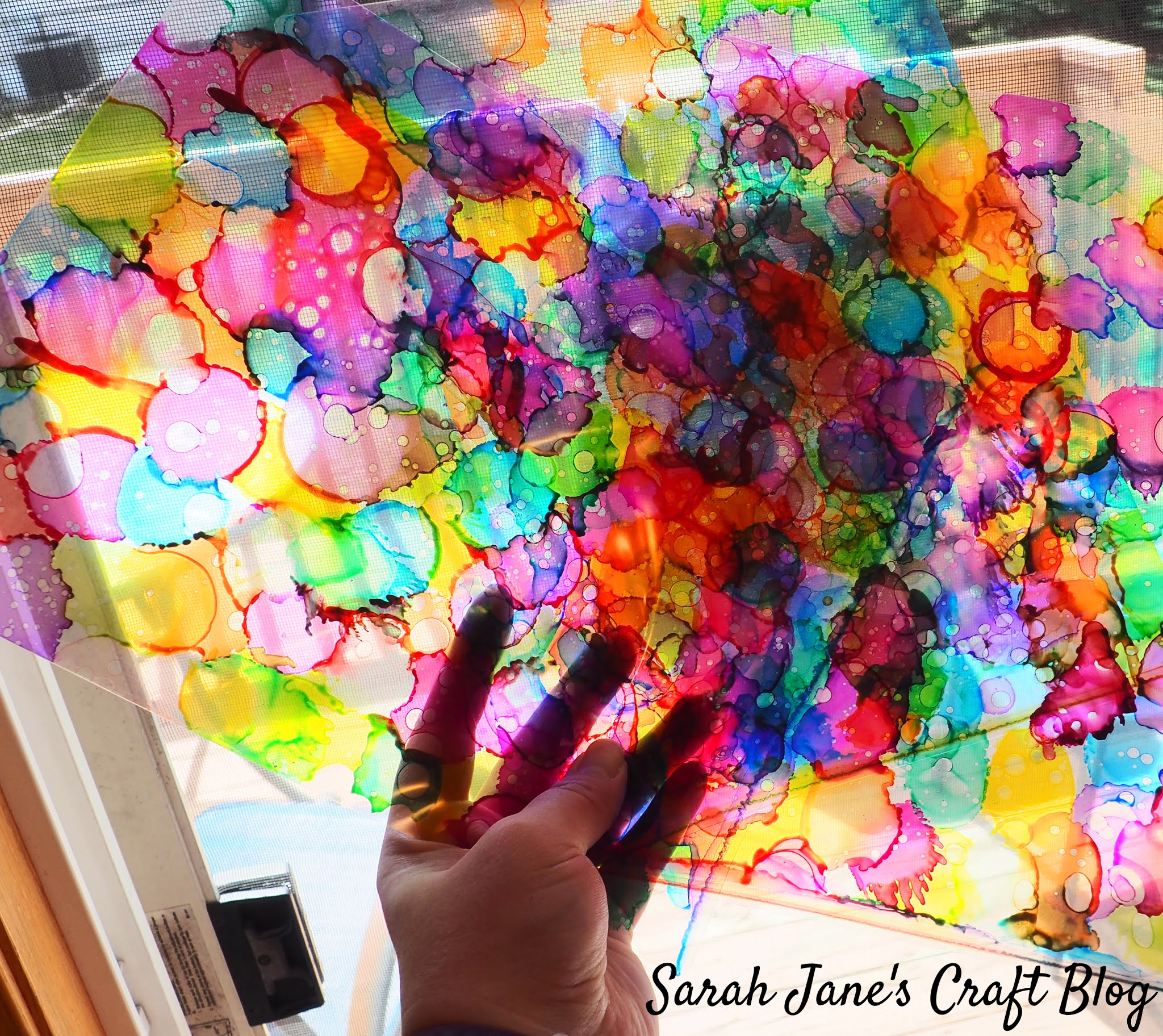 Faux Stained Glass made with Alcohol Ink, Laminating Pouches, and Vinyl