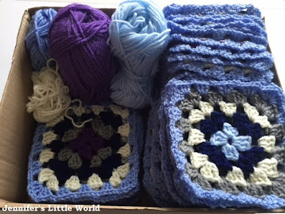Box of crochet granny squares