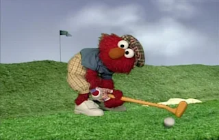 Dorothy imagines Elmo is a golfer. He makes a good shot and the ball comes pretty close to the hole. Elmo's World Balls Tickle Me Land