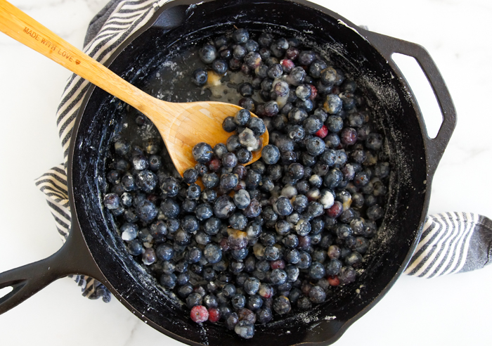 making blueberry cobbler