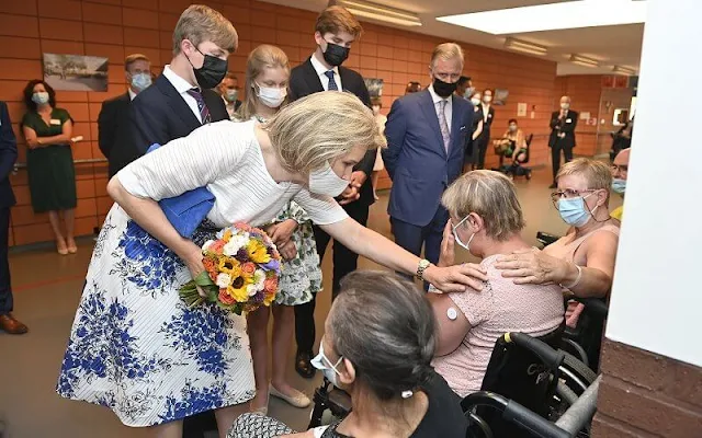 Princess Eleonore wore a roman-lace inset floral print dress from Maje. Blue floral print dress from Carolina Herrera