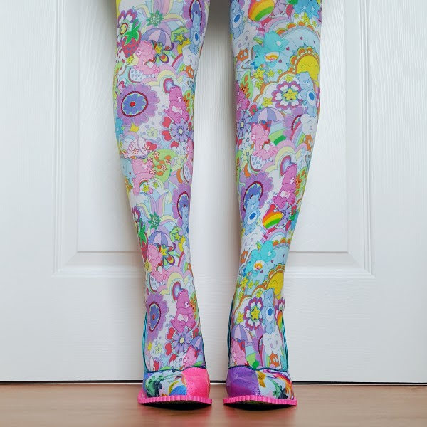 front of legs wearing Care Bear tights and colourful pointed toe court shoes