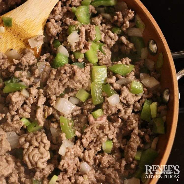 Process shot of Johnny Marzetti by Renee's Kitchen Adventures browning ground beef with vegetables in skillet