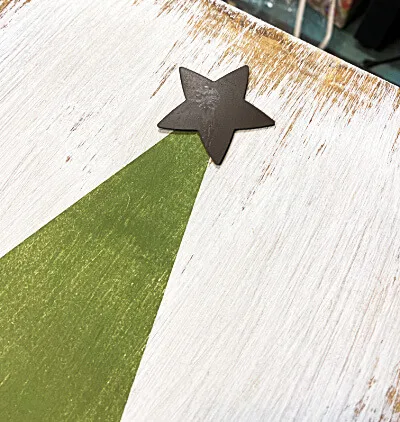 metal star on the top of the tree