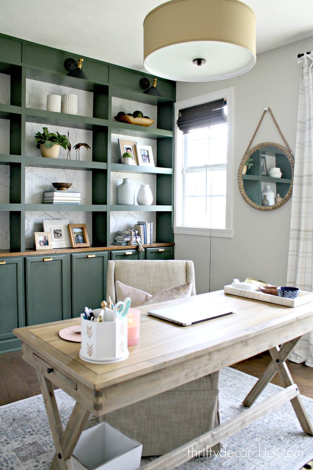 Wall of DIY bookcases in office