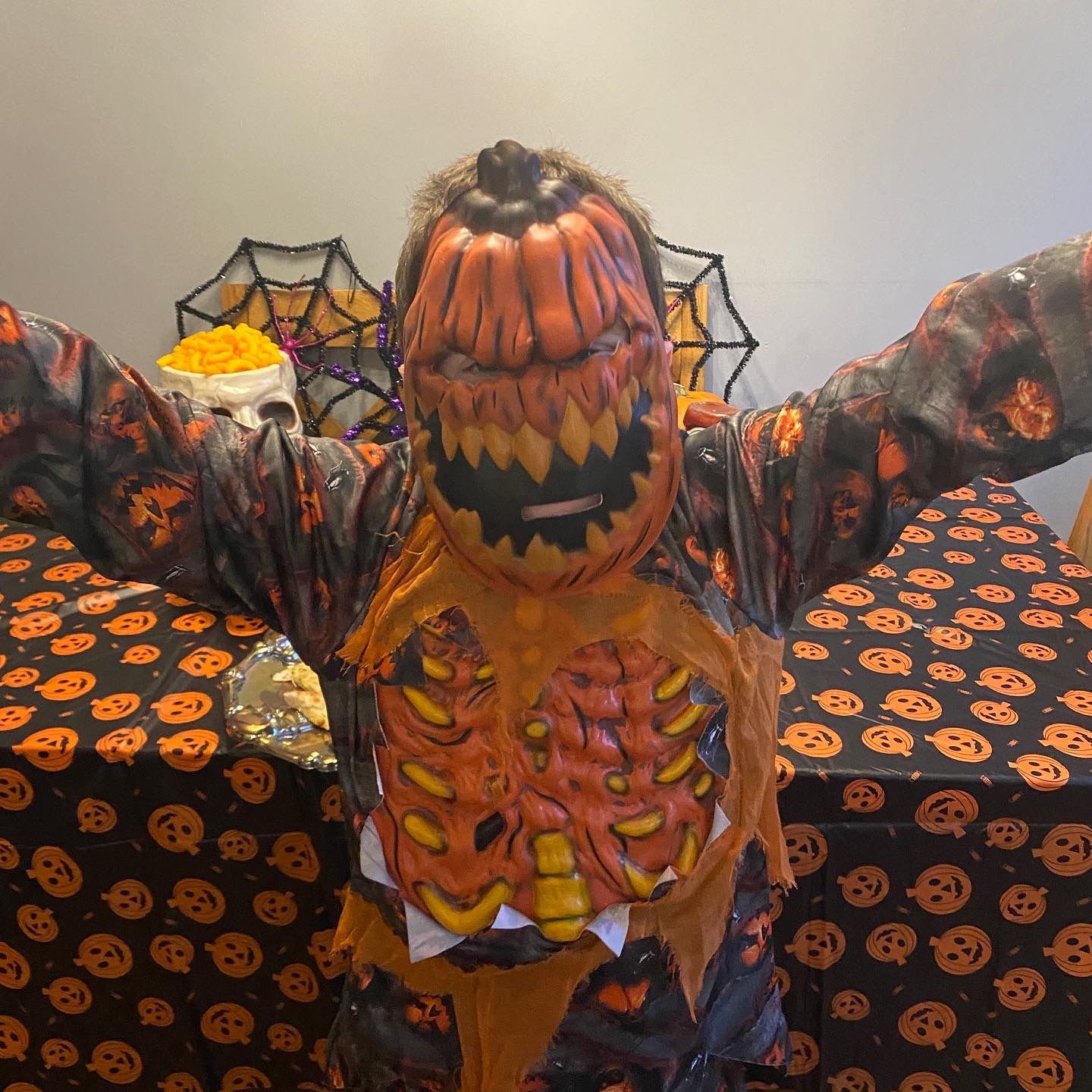 boy dressed as a scary pumpkin