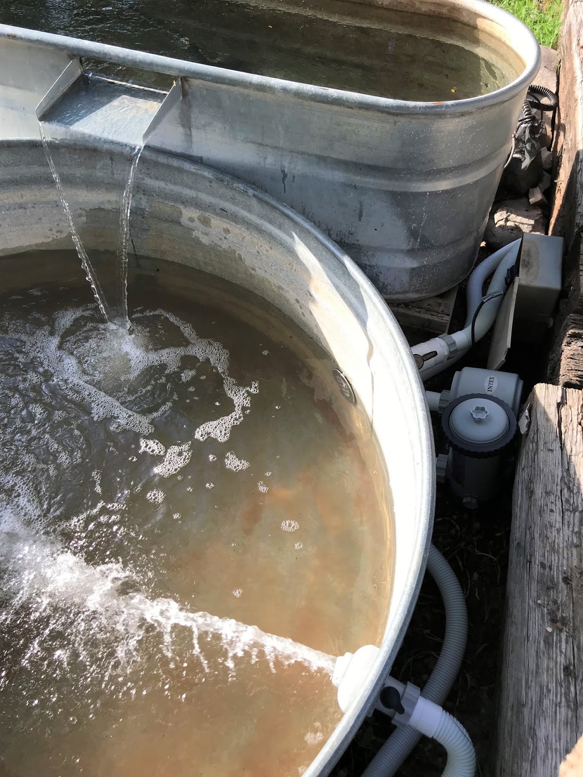 Clover House How to Install a Stock Tank Pool with a Waterfall