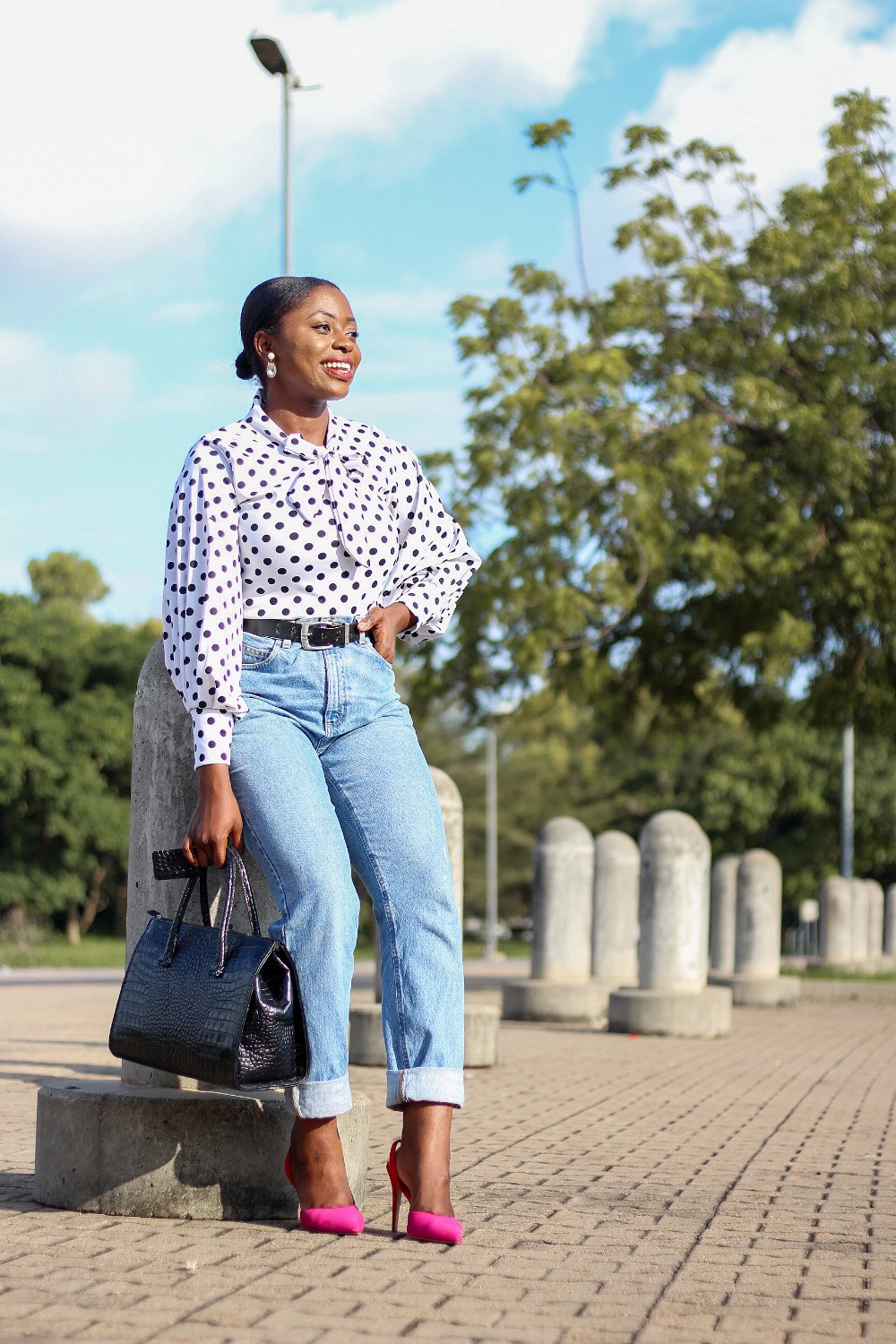 mom jeans styled with polkadot blouse