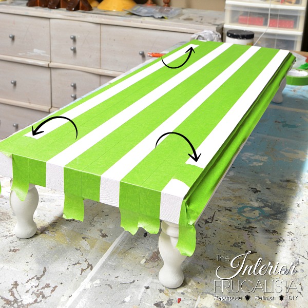 Use strips of painter's tape to paint perfectly straight stripes.