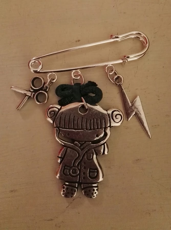 BROCHE DE AUXILIAR EN RAYOS