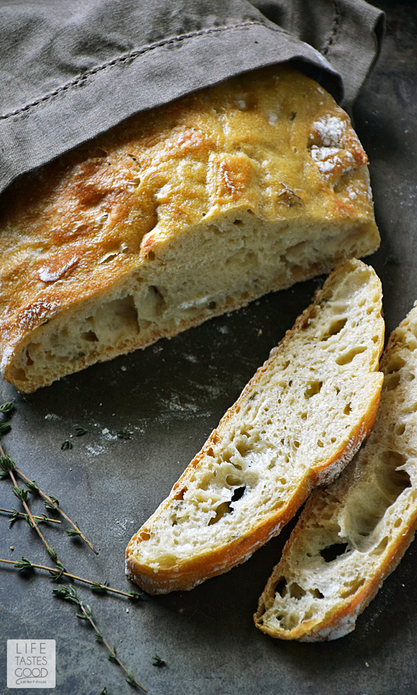 Crusty Artisan Style Bread | by Life Tastes Good has a wonderfully tangy flavor with a crispy outside and soft, chewy inside. With this no-knead recipe, it's easy to craft homemade bread just like the bakery! Makes a lovely hostess gift with a bottle of wine, and it's perfect for Thanksgiving! #LTGrecipes