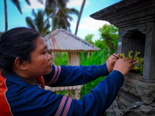 Woman Make Simple Offerings Of Canang Sari In The Balinese Shrines Of Agricultural Area At The Village North Bali Indonesia