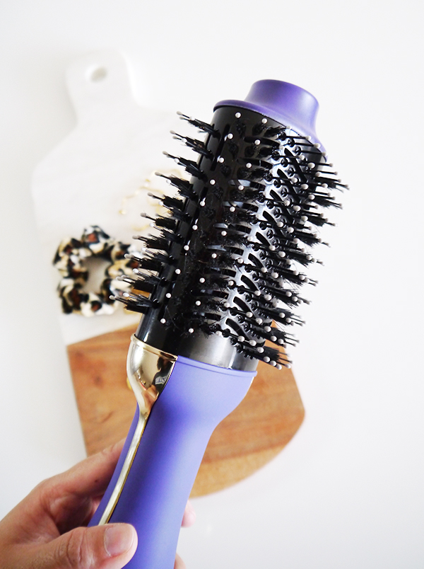 Detail shot of Hot Tools Signature Series Hair Styler showing mix of boar and plastic ball-tipped bristles on the oval-shaped brush barrel