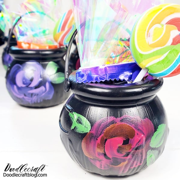 Some iridescent tissue paper is the perfect finishing touch for stuffing these mini cauldrons with treats!