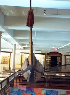 end view of Solomon Islands canoe at Peabody Museum