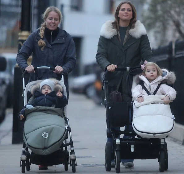 Princess Madeleine was seen in downtown of London while she was showing her children Princess Leonore and Prince Nicolas, Princess Madeleine wore coat, style