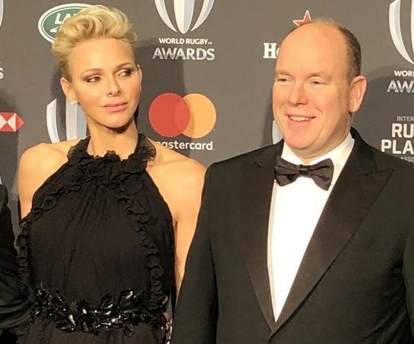 Princess Charlene is wearing her Gucci gown first worn in 2012 at 2017 World Rugby Award ceremony. Dior earrings